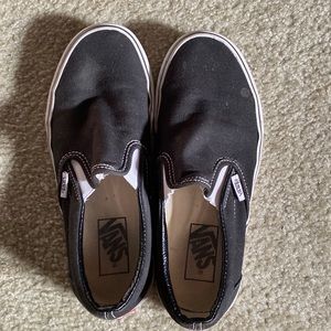 Black and white slip on vans